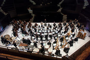 Musicians of the Helsinki Philharmonic Orchestra on stage at Musiikkitalo.