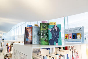 Books with emotion bookmarks on the Central Library Oodi's bookshelf.