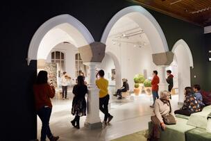 People watching a musical performance at a museum.