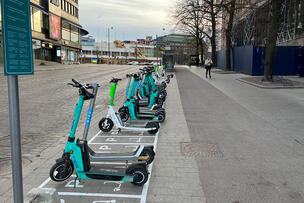 Electric scooters parked in the city centre in summer 2022.