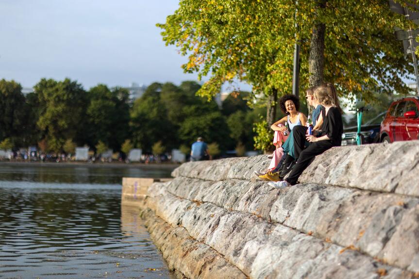 Group of friends having a good time at Helsinki Festival and in Tokoinlahti Bay Area.