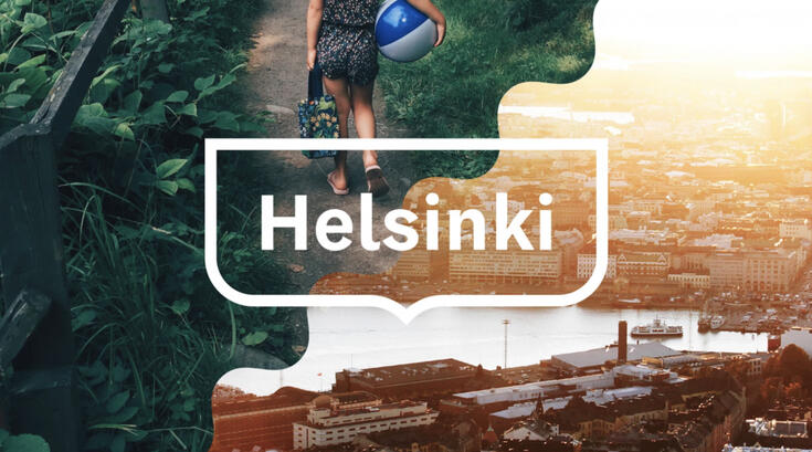 Valokuva Helsingistä, jonka päällä on Helsingin kehystunnus